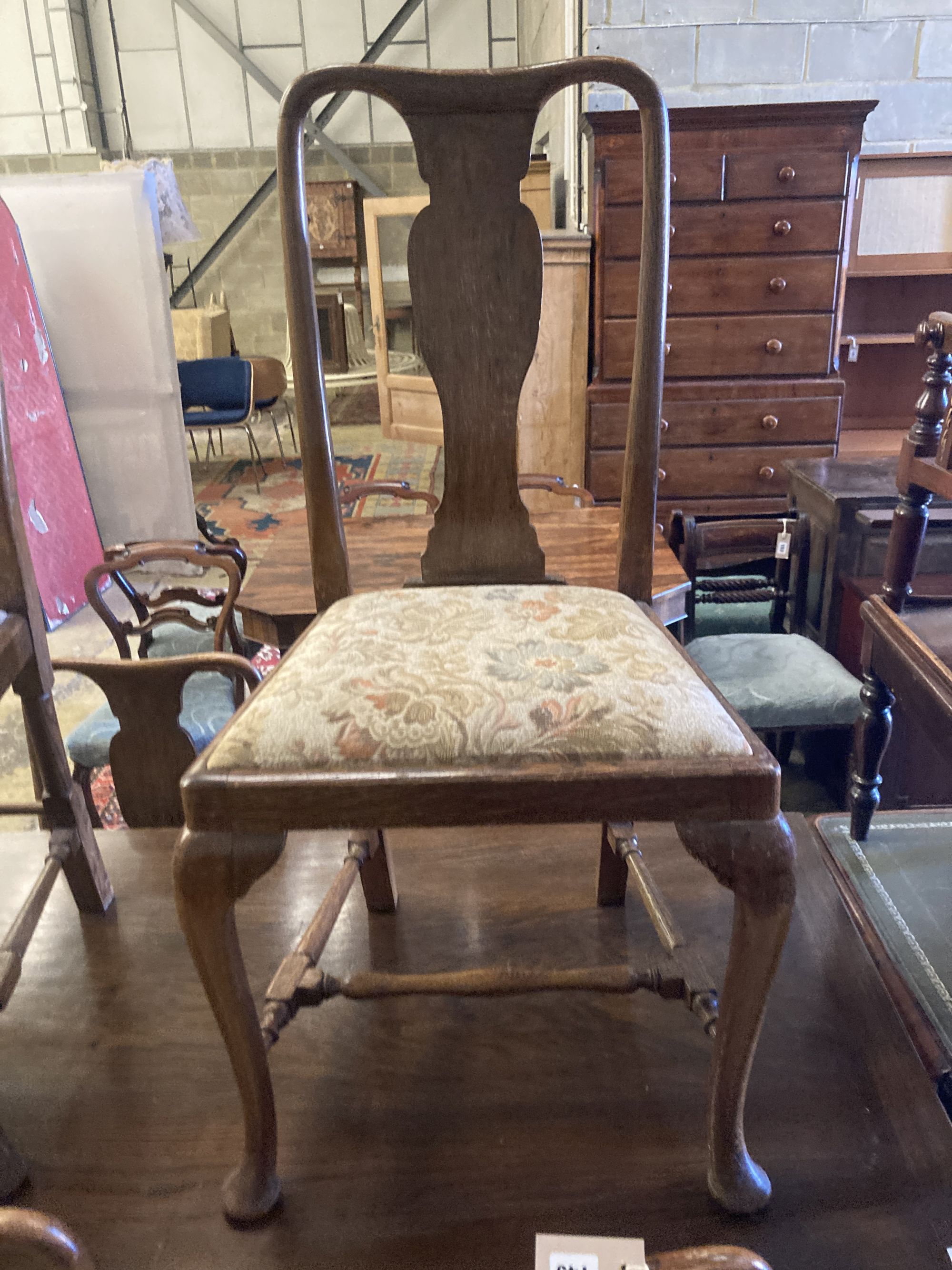 A set of eight 1920s oak Queen Anne-style dining chairs, two with arms